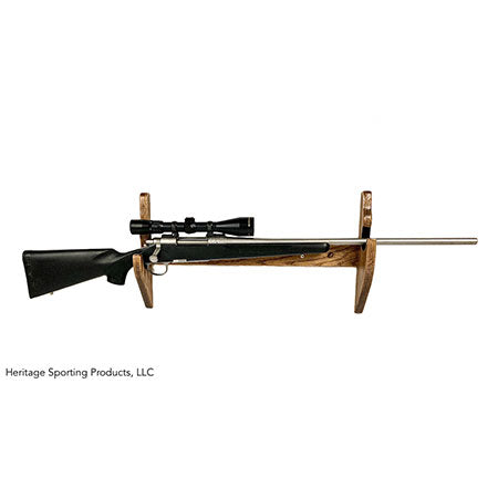 One piece wall mounted wood gun rack holds a rifle with scope