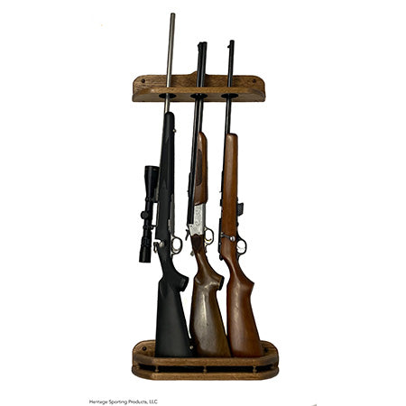 Two piece vertical gun rack mounted on a wall or door with 3 barrel rests for displaying 3 long guns. Oak finished with dark walnut stain.
