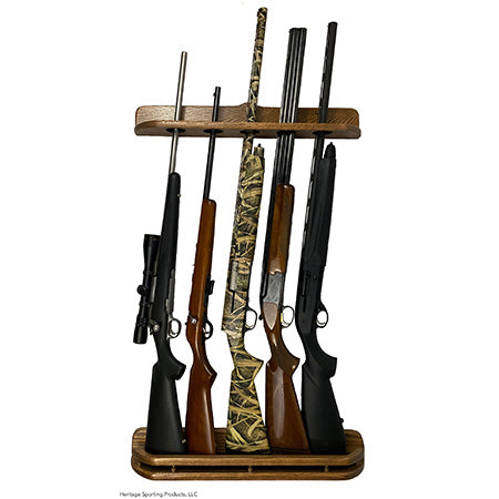 Heritage Sporting Products 5 gun vertical wall gun rack displaying 5 long guns. Two pieces mounted to a wall. Red Oak gun display finished with Minwax special walnut stain