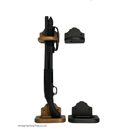 Home defense gun rack shown in dark oak stain and black poly. The top piece has a C shaped hold for quick removal. The bottom piece has a felted bottom rest. Shown displaying a tactical sawed off shotgun