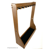 Empty 8 gun vertical gun rack. Wood gun rack with a dark oak stained finish. Felted barrel rests and carpeted bottom. Brand: Heritage Sporting Products